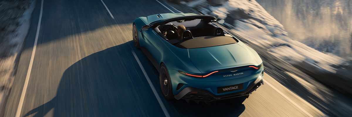 Aston Martin Vantage Roadster in motion with the top down